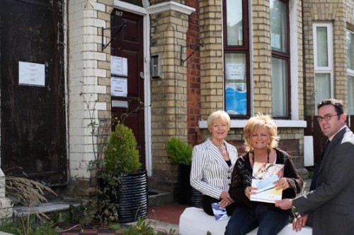 It is difficult to imagine that these two derelict houses will eventually be a Centre of Excellence for PIPS but the organisation has already raised half the money needed and to assist with the other half. Gary McGuigan, President and Doris Leeman Executive Secretary, NI Grain Trade Association present a cheque to PIPS Co-ordinator, Jo Murphy.