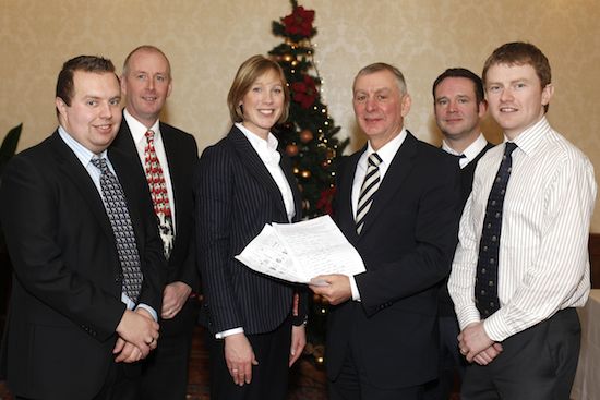 Robin Irvine, who won both competitions checks his entries with NIGTA President, Claudine Heron. Also included are the other winners, Alan Thompson, Jim Uprichard, Peter Davison and David Mawhinney